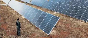  ?? Picture: Bloomberg/Waldo Swiegers ?? A field of solar panels at the Kathu solar park in the Northern Cape.