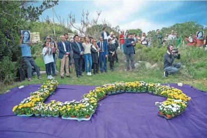  ?? ?? From left, EU Parliament member David Casa; EU Parliament President Roberta Metsola; Maria Falcone, sister of slain judge Giovanni Falcone; and lawyer Robert Aquilina stand during a silent gathering to remember Daphne Caruana Galizia Sunday.