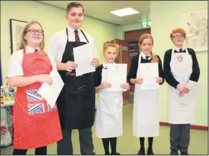  ??  ?? The Market Bosworth School pupil Tessa Dodd, second from right, beat fellow student cooks from left Megan Clark, Aaron Broadhurst, Mae Wilkinson and Lara Makin in a school heat of the 2017-18 Rotary Young Chef contest