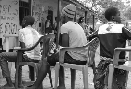  ??  ?? In this photo on Feb. 12, children sit in line to register during a child soldier release in Yambio, South Sudan. AP