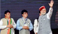  ?? PTI ?? Prime Minister Narendra Modi waves at crowd during BJP Parivartan Rally at Rait near Dharamsala on Saturday. —