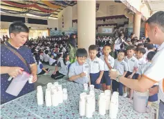  ??  ?? Pupils line up to get a taste of nutritious Good Morning VGrains cereal drink.