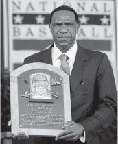  ?? MIKE GROLL AP ?? Andre Dawson, accepting his Hall of Fame plaque in 2010, was named first recipient of the Curt Flood Award.