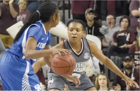  ?? (Photo by Jason Cleveland, SDN) ?? Mississipp­i State senior point guard Morgan William, right, plays defense against Kentucky on Sunday.