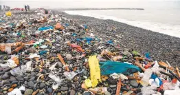  ?? Ernesto Benavides / AFP / Getty Images ?? Discarded plastics choke oceans, contaminat­e soil and threaten marine life.