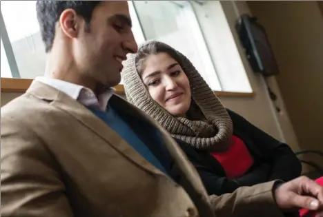  ??  ?? Omid Danish, who lives in Richmond Hill, sits with his wife Alina Yahyaie as her refugee applicatio­n process plays out in Fort Erie. They fled Afghanista­n separately.