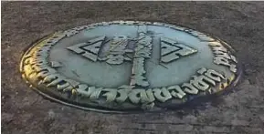  ?? AP PIC ?? This bronze plaque commemorat­ing Thailand’s 1932 revolution was ripped out of the pavement of the Royal Plaza in Bangkok recently and replaced with another one praising the Chakri dynasty.