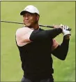  ?? Christian Petersen / Getty Images ?? Tiger Woods plays his second on the 13th hole during the third round of the PGA Championsh­ip at Southern Hills Country Club on Saturday in Tulsa, Okla.