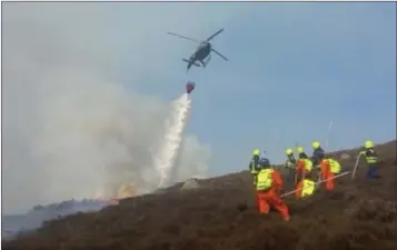  ??  ?? Wicklow Fire Services and the Irish Air Corps working in tandem.