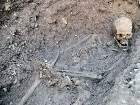  ?? UNIVERSITY OF LEICESTER/GETTY Images files ?? A handout picture released by the University of Leicester shows the skeleton of King Richard III found at the Grey Friars Church excavation site in Leicester.