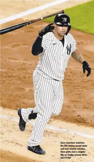  ??  ?? Gary Sanchez watches his 8th inning grand slam sail into stands Sunday, then gives bat a mighty flip as Yanks sweep Mets. GETTY/AP