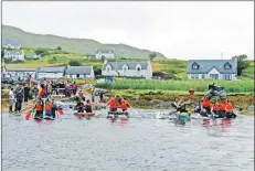  ??  ?? The raft race competitor­s battle it out on the water.