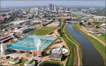  ?? TY GREENLEES / STAFF ?? The Mad River flows past Dayton’s Ottawa Water Treatment Plant on the east side of the city. Tests indicated that polyfluora­lkyl substances (PFAS) were present in the drinking water in 2018, and as a result, Oakwood plans to test its water this year.