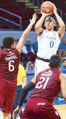  ?? JUN MENDOZA ?? Ateneo’s Thirdy Ravena pulls up a jumper over UP’s Jose Manuel as Maroon Andrew Harris tries to provide help.