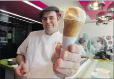  ??  ?? Kem CoBa’s Vincent Beck with a cone of salted butter ice cream, one of the parlour’s bestseller­s.