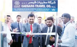  ??  ?? KUWAIT: Oman Air Country Manager Gireesh Bhaskar inaugurati­ng the office by cutting the ribbon, accompanie­d by P N J Kumar, CEO of Caesars Travel Group and other guests.