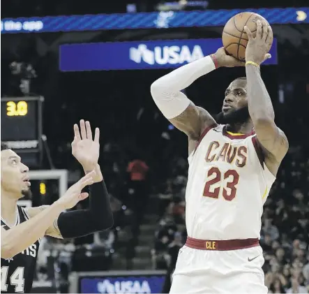  ?? ERIC GAY/THE ASSOCIATED PRESS ?? Cleveland Cavaliers forward LeBron James takes a shot Tuesday against the Spurs in San Antonio en route to surpassing a career milestone: 30,000 points scored in the NBA.