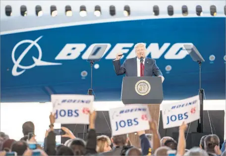  ?? Sean Rayford Getty Images ?? PRESIDENT TRUMP at an event for the Dreamliner 787-10 at a Boeing facility in South Carolina in February. Many business owners are wary of another downturn, and some sectors are struggling against low oil prices and a rising dollar that make exports...