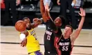  ?? Photograph: Kim Klement/USA Today Sports ?? Heat forward Bam Adebayo (13) defends against the Lakers’ LeBron James during the third quarter of Wednesday’s Game 1 of the NBA finals.