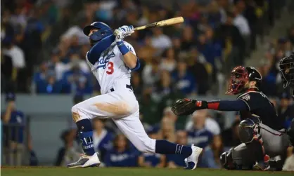  ?? Braves. Photograph: Jayne Kamin-Oncea/USA Today Sports ?? Los Angeles Dodgers left fielder Chris Taylor hits his third home run of the night in the seventh inning of Thursday’s Game 5 of the NLCS against the Atlanta