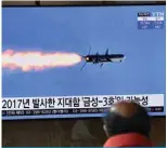  ??  ?? SEOUL: A man watches a television news broadcast showing file footage of a North Korean missile test, at a railway station in Seoul yesterday. —AFP