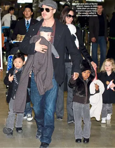  ??  ?? Pitt and Jolie at Narita airport, Japan, in 2009 with their six-strong brood in happier times. The couple called it quits seven years later.