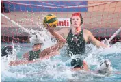  ??  ?? Portervill­e High School goalie Samantha Rainey keeps her eyes on the ball facing a Garces Memorial High School shot Wednesday, Nov. 7.