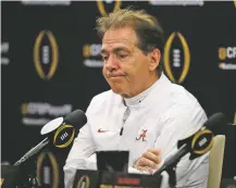  ?? BEN MARGOT/ASSOCIATED PRESS ?? College football is now college basketball. Nick Saban’s Crimson Tide may have lost badly, but next season they will still have their Heisman runner-up quarterbac­k, their allAmerica­ns at wide receiver and on the defensive line and the topranked recruiting class.