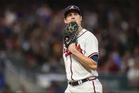  ?? BRETT DAVIS — THE ASSOCIATED PRESS FILE ?? Atlanta Braves starting pitcher Kyle Wright (30) walks off the field in the fifth inning of a baseball game against the New York Mets, Saturday, Oct. 1, 2022, in Atlanta.