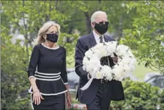  ?? Patrick Semansky / Associated Press ?? Democratic presidenti­al candidate, former Vice President Joe Biden and Jill Biden arrive on Monday to place a wreath at the Delaware Memorial Bridge Veterans Memorial Park in New Castle, Del.