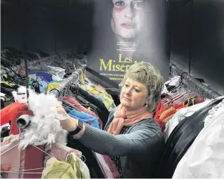  ?? PHOTO: GREGOR RICHARDSON ?? Raring to go . . . Musical Theatre Dunedin wardrobe manager June Driver dusts off costumes for the theatre company’s production of Les Miserable, in Dunedin, next May.