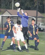  ?? AUSTIN HERTZOG - MEDIANEWS GROUP ?? Upper Perkiomen goalkeeper Matthew Wanamaker rises up to punch a free kick against Perkiomen Valley.