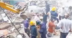  ??  ?? People and rescue personnel are seen after a building collapsed.— Reuters photo