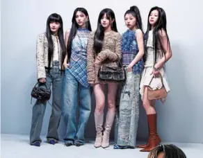  ?? — reuters ?? (From left) Illit members yunah, Minju, Moka, Wonhee and Iroha make their debut at Paris Fashion Week posing for photos at acne studios presentati­on.
