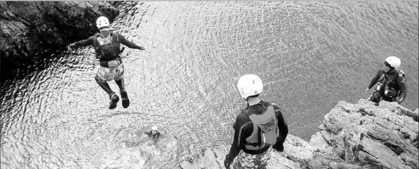  ?? — Photo courtesy Visit Wales ?? If you’ve got guts, a morning of coasteerin­g in Wales finishes with the most daring cliff jump.