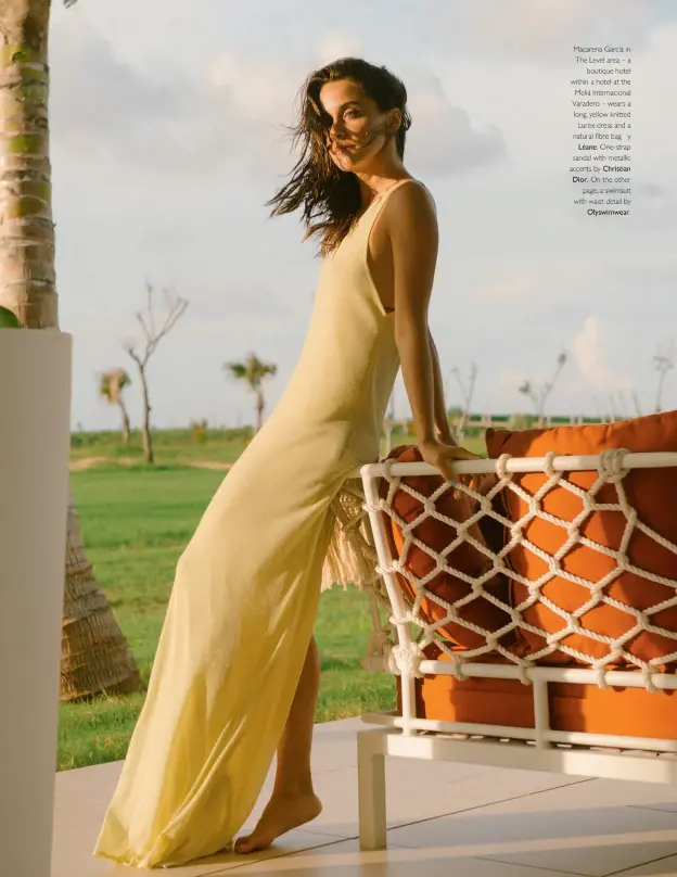  ??  ?? Macarena García in The Level area – a
boutique hotel within a hotel at the Meliá Internacio­nal Varadero – wears a long, yellow knitted
Lurex dress and a natural fibre bag y
Léane. One-strap sandal with metallic accents by Christian Dior. On the other
page, a swimsuit with waist detail by
Olyswimwea­r.