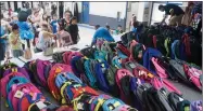  ??  ?? The third annual Grandparen­ts Raising Grandchild­ren’s backpack giveaway was held Friday, July 20 at Jim Maples Academy in Portervill­e. 230 backpacks with school supplies were given to K-12 students.