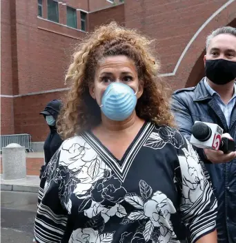  ?? NAncy lAnE / HErAld stAFF FilE ?? POLICE CHARGED: Diana Lopez leaves court as current and former members of the Boston Police Dept. leave federal court after facing charges relating to claiming false overtime on Wednesday. Far left, Gerard O’Brien followed by Henry Doherty leave court.