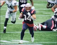  ?? Charles Krupa / Associated Press ?? New England Patriots running back Rex Burkhead runs with the ball against the Las Vegas Raiders in the second half on Sunday in Foxborough, Mass.