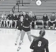  ?? ?? St. Andrew's junior setter Charlotte Glass defends a hit from Jupiter to keep the point alive for the Scots during a match in Boca Raton on Tuesday.