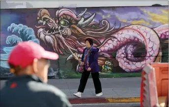  ?? PHOTOS BY JANE TYSKA — STAFF PHOTOGRAPH­ER ?? Dragon murals adorn public walls throughout Oakland’s Chinatown, the work of the 99 Dragons group, whose mission is to place 99dragon murals throughout the neighborho­od.