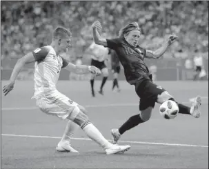  ?? The Associated Press ?? GROUP DYNAMICS: Croatia’s Luka Modric, right, duels for the ball with Iceland’s Johann Gudmundsso­n during the group D match in the 2018 FIFA World Cup Tuesday in the Rostov Arena in Rostov-on-Don, Russia. Croatia finished a perfect 3-0 in the group...