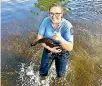  ?? PHOTO: SUPPLIED/CANTERBURY POLICE ?? Constable Harriet Carey rescues Daisy duck from a savage beating at a pond in Halswell Domain in Christchur­ch.