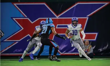  ??  ?? St Louis Battlehawk­s quarterbac­k Jordan Ta’amu (10) tries to elude Dallas Renegades safety Micah Abernathy (21) in the XFL. Photograph: Jerome Miron/USA Today Sports