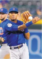 ?? RICK SCUTERI/ASSOCIATED PRESS ?? Major League Baseball has put Cubs shortstop Addison Russell on seven-day administra­tive leave, but that could be extended.