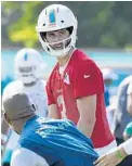  ?? TAIMY ALVAREZ/SUN SENTINEL ?? The Miami Dolphins’ Josh Rosen listens during the Dolphins’ first day of training camp Thursday at Nova Southeaste­rn University in Davie.