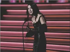  ?? AP PHOTO/CHRIS PIZZELLO ?? Olivia Rodrigo accepts the award for best pop vocal album for “Sour” at the 64th Annual Grammy Awards on Sunday in Las Vegas.