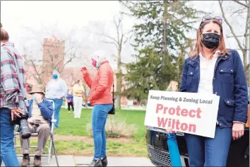  ?? Jarret Liotta / For Hearst Connecticu­t Media ?? Kim Healy, of Wilton, makes her voice heard at a rally at Town Hall organized by CT 169 Strong on Saturday in Fairfield.