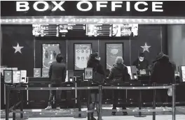  ?? EVAN AGOSTINI Invision/AP ?? Movie theaters reopen in New York on Friday after almost a year of being closed because of the COVID-19 pandemic.