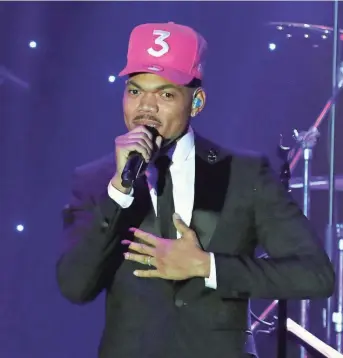  ?? WILLY SANJUAN/INVISION/AP ?? Grammy winner Chance the Rapper, seen in 2020, is bringing a secret concert filmed four years ago to the big screen next month. “Magnificent Coloring World” premieres Aug. 13 in select AMC Theatres.